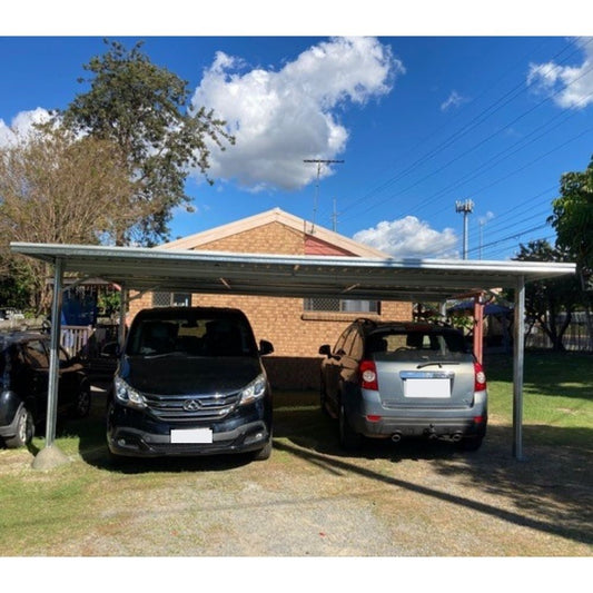 Flat roof carport sheltering two parked cars, with metal posts