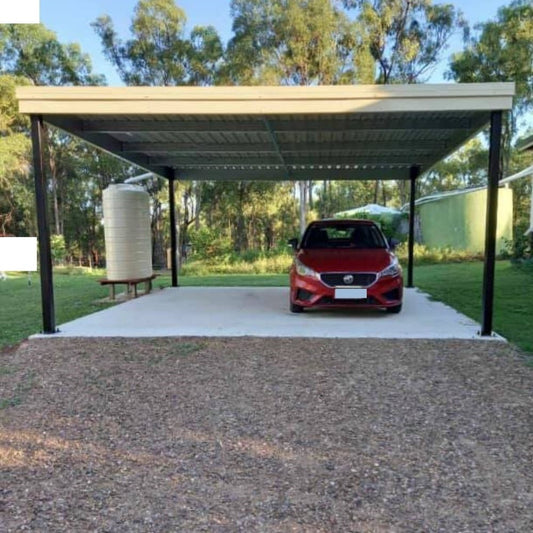 Skillion carport with open-front frame over a concrete driveway