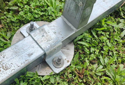 Galvanized metal ground anchor with bolts and round base plate